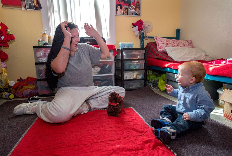 A prisoner playing with her son