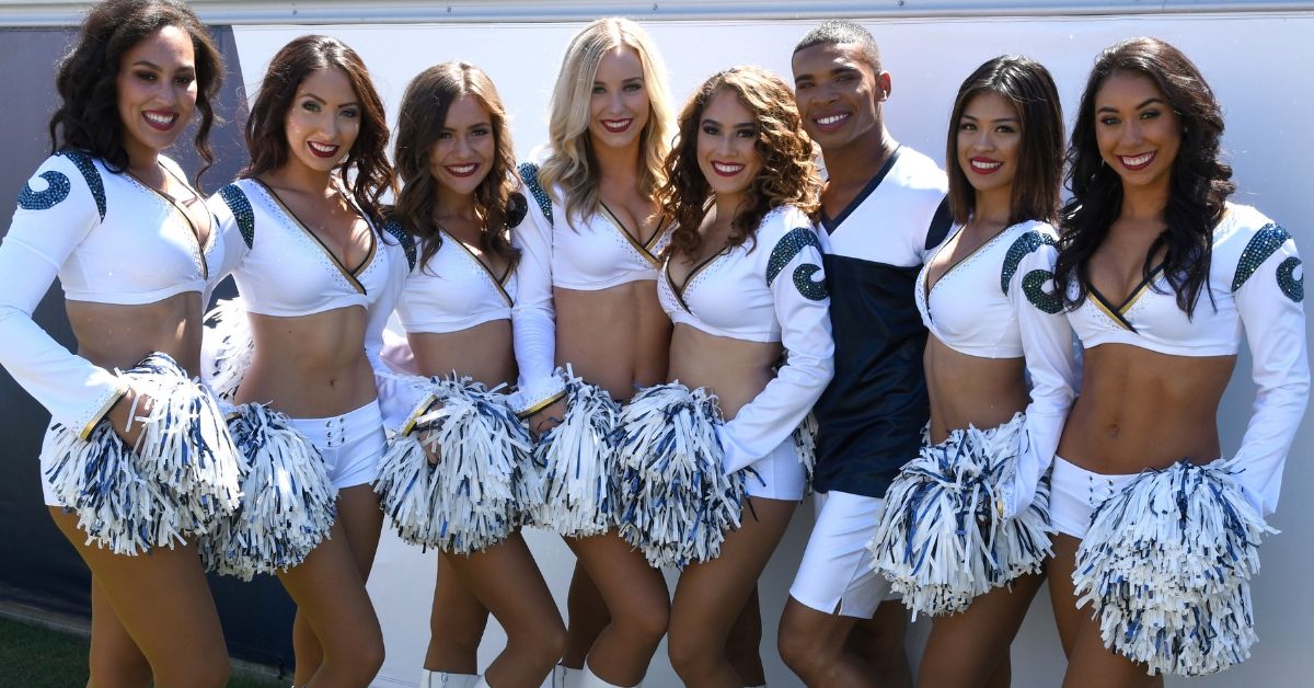 Los Angeles Rams cheerleaders pose with a child during - NARA & DVIDS  Public Domain Archive Public Domain Search